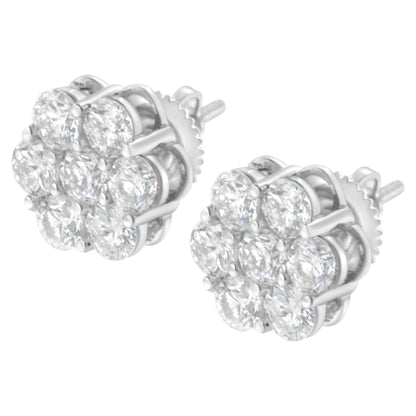 Pair of white metal stud earrings with multiple round white gemstones in prong settings, shown from a front angle.