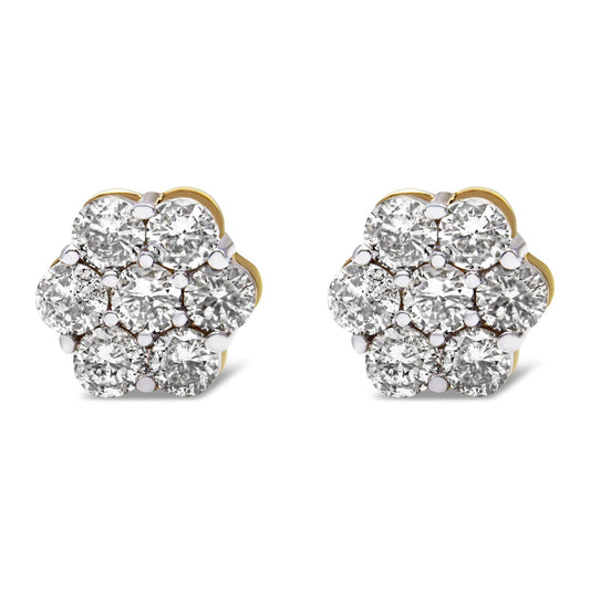 Front angle view of pair of yellow metal flower-shaped earrings with white round gemstones in prong settings.