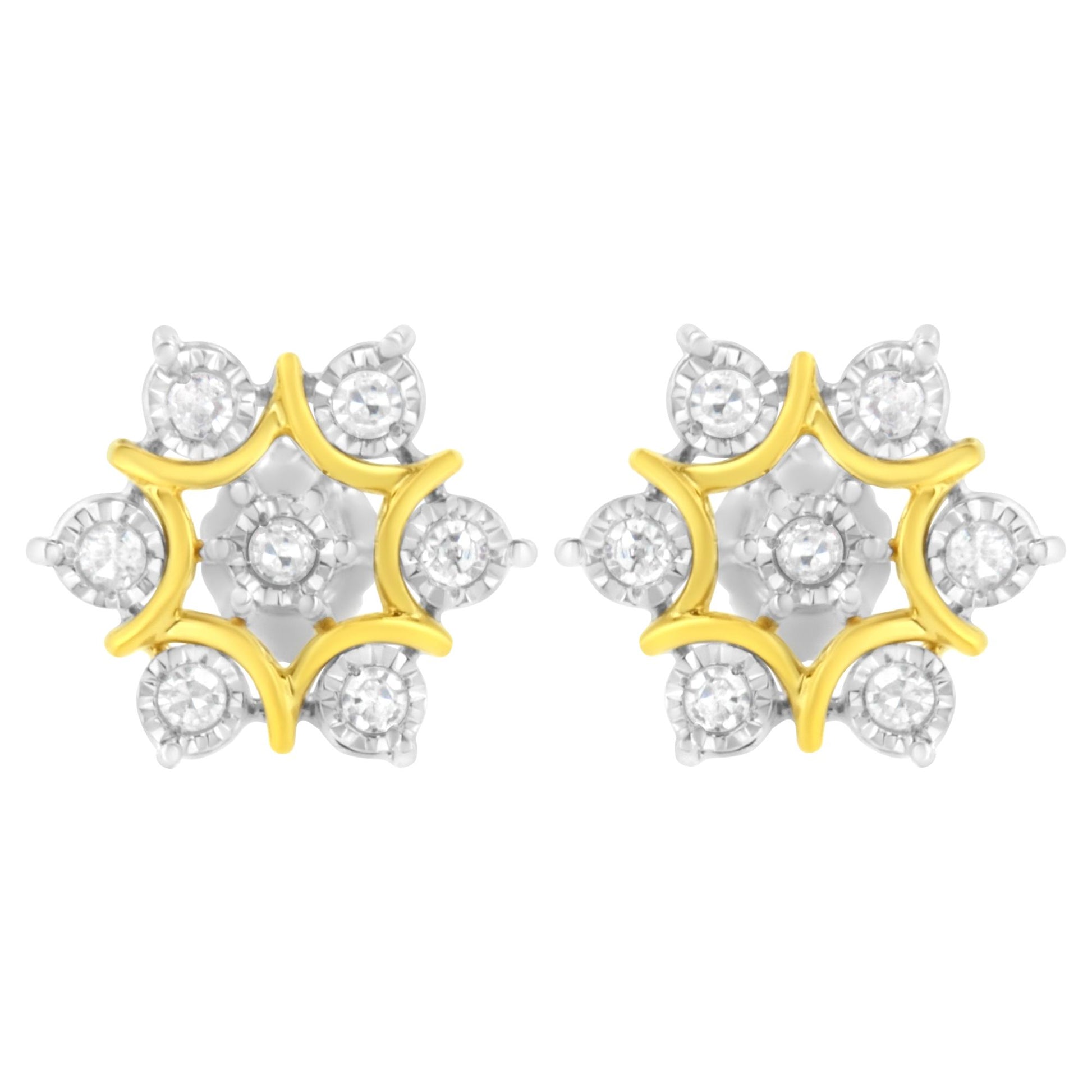 Front-facing view of a pair of yellow metal earrings with a star-shaped design featuring round white gemstones in a miracle setting.