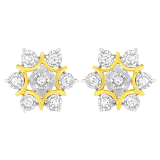 Front-facing view of a pair of yellow metal earrings with a star-shaped design featuring round white gemstones in a miracle setting.