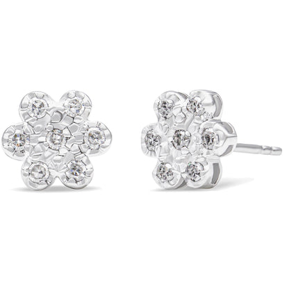 Front and side angled view of white metal flower-shaped stud earrings with round white gemstones in prong settings.