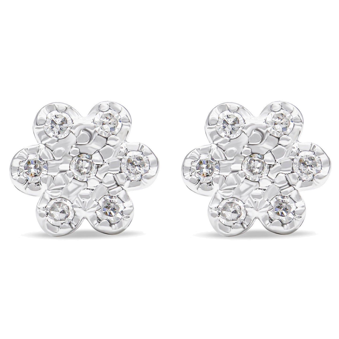 Front view of a pair of white metal flower-shaped earrings with round white gemstones in prong settings.