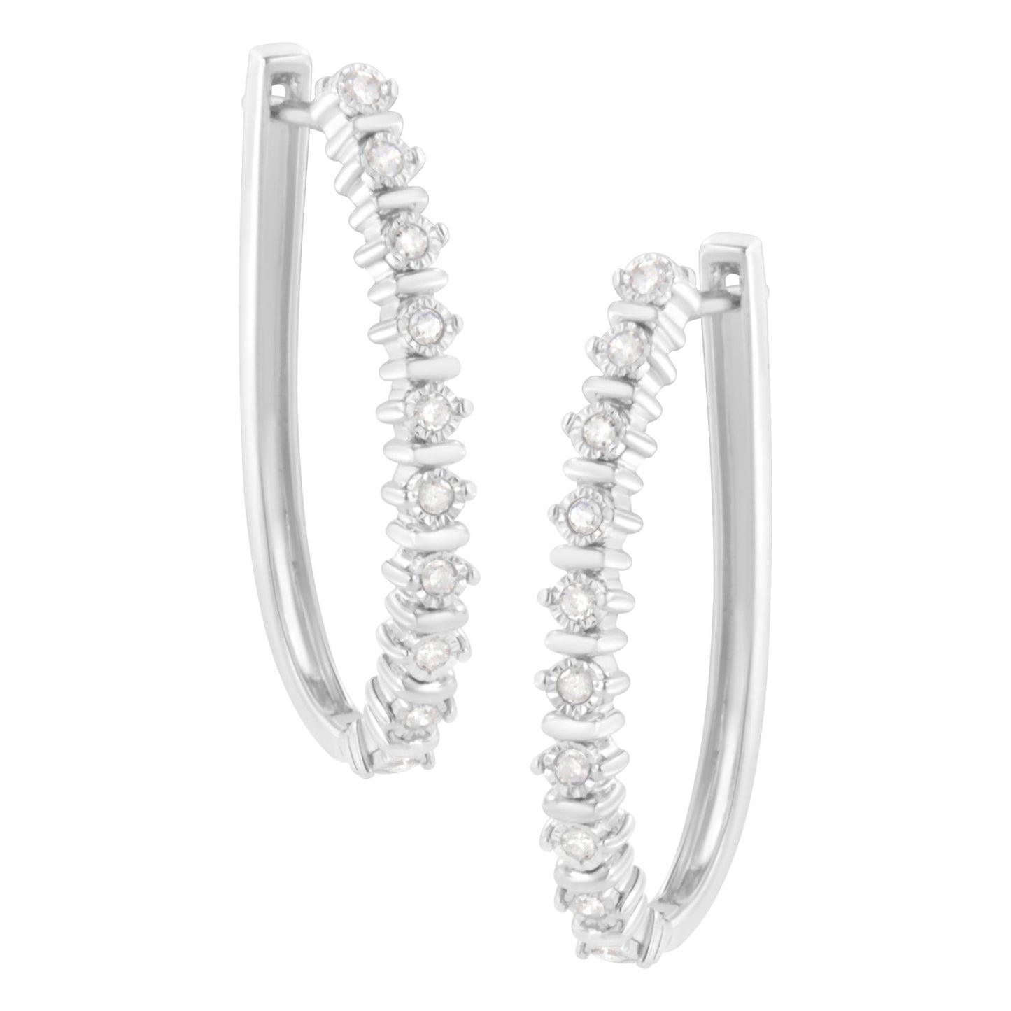 Close-up front angle view of white metal hoop earrings with round white gemstones in a miracle setting.