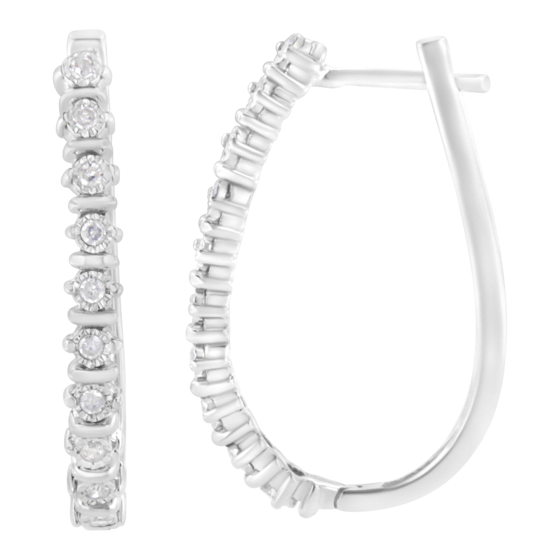 Close-up front and side view of white metal hoop earrings with round white gemstones in a miracle setting along the front edge.