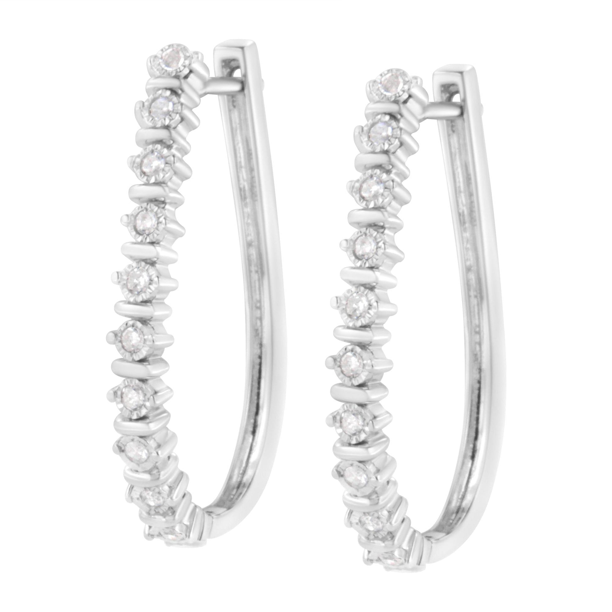 Close-up front angle of a pair of white metal hoop earrings set with round white gemstones in miracle setting.