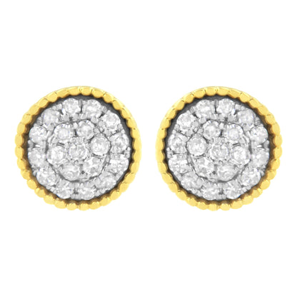 Front view of round stud earrings with white gemstones in a prong setting, surrounded by yellow metal scalloped edges.