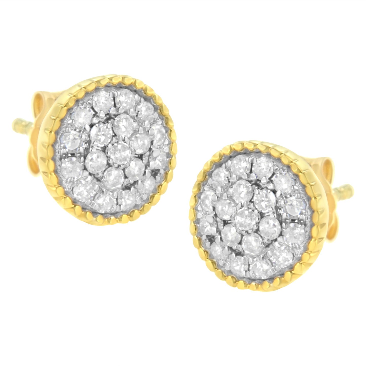Close-up front angle of a pair of round earrings with white gemstones in prong settings, surrounded by yellow metal edges.