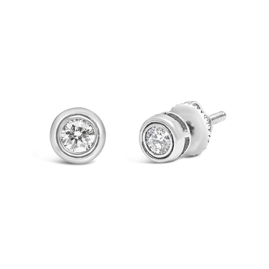 Pair of white metal stud earrings with round white gemstones in bezel settings, shown from front and angled side views.