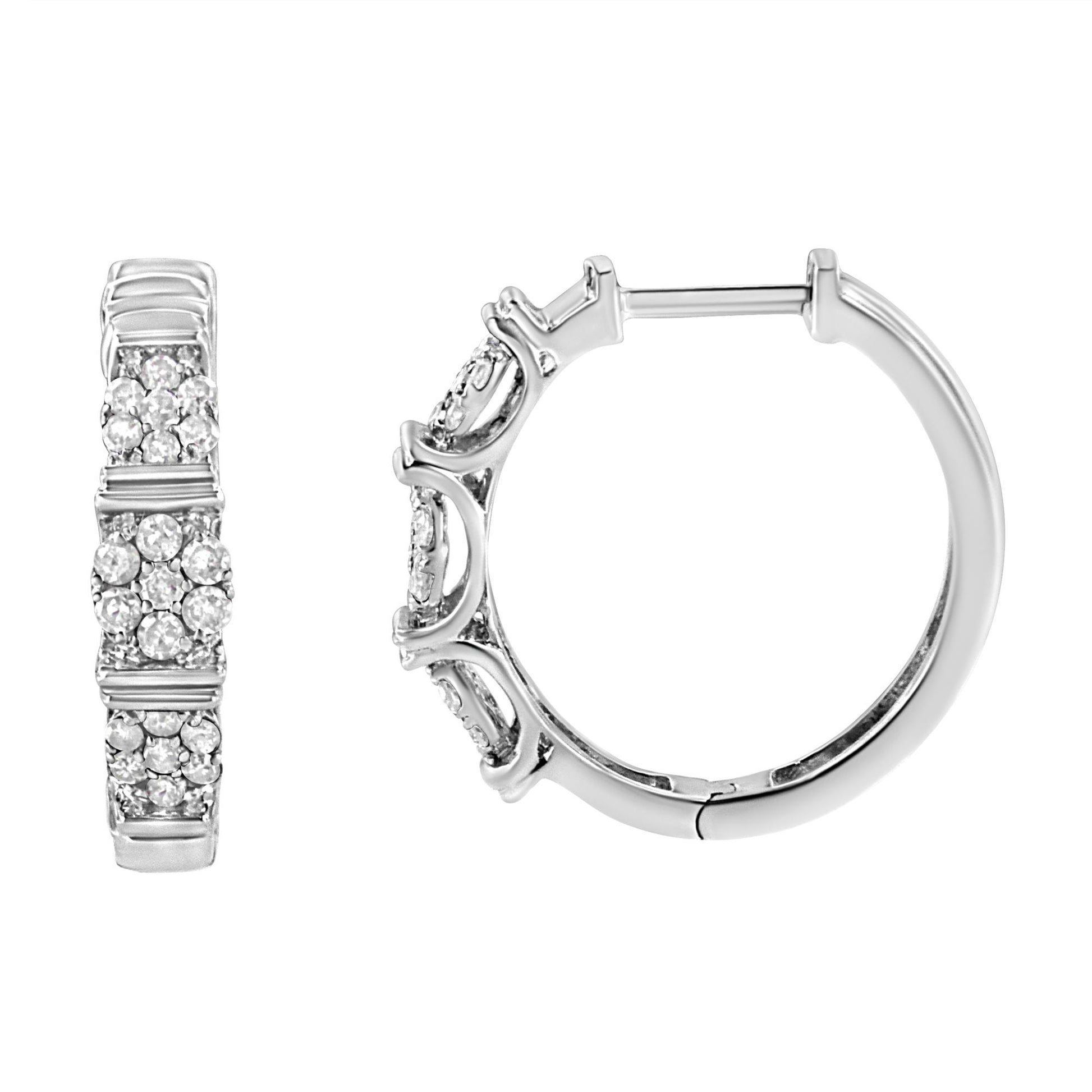 Front and side view of white metal hoop earrings with round white gemstones in prong settings.