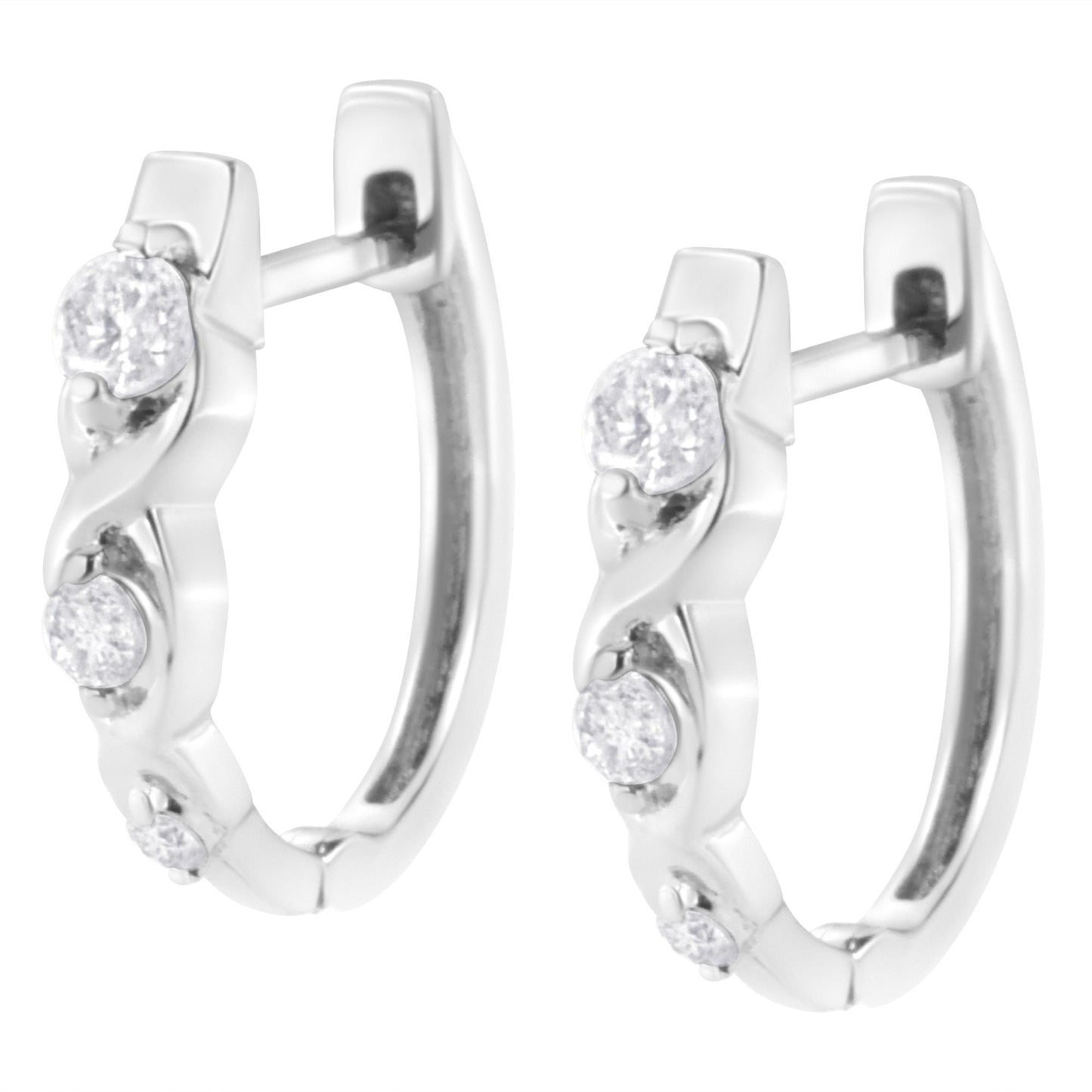 Pair of white metal hoop earrings set with multiple round white gemstones, shown in a front angled close-up view.