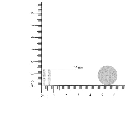 Pair of white metal earrings with three round white gemstones set in prongs, displayed on a ruler for size reference, front angle.