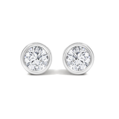Close-up front view of white metal round bezel-set stud earrings with white gemstones, shown on a white background.