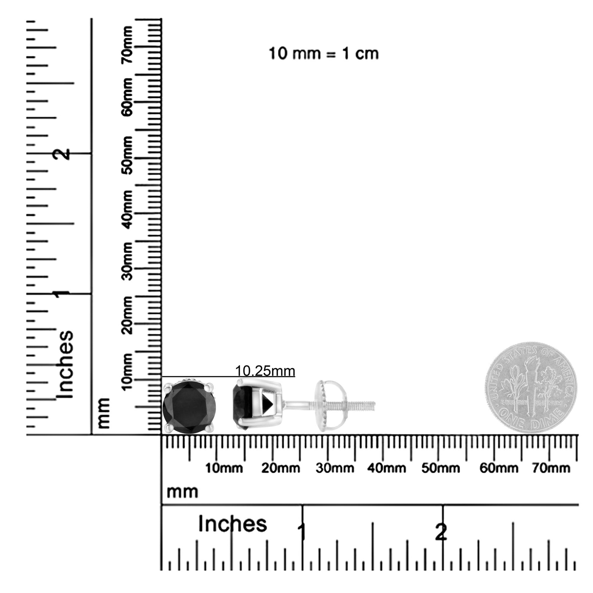 White metal stud earrings with round black gemstones in prong settings, shown side and front views, placed on a ruler and scale for size reference.