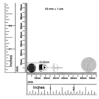 White metal stud earrings with round black gemstones in prong settings, shown side and front views, placed on a ruler and scale for size reference.