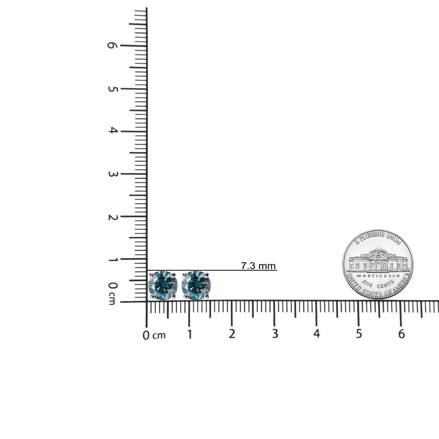 Top-down view of white metal stud earrings with round blue gemstones in 4-prong settings, placed on a ruler for size reference.