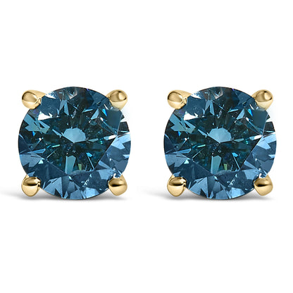 Front view of yellow metal stud earrings each featuring a round blue gemstone in a four-prong setting.