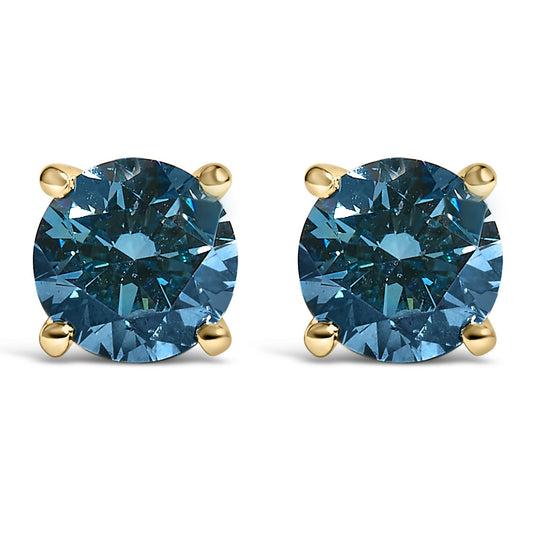 Front view of yellow metal stud earrings each featuring a round blue gemstone in a four-prong setting.