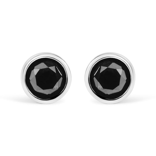 Front view of white metal stud earrings with round black gemstones in bezel settings.
