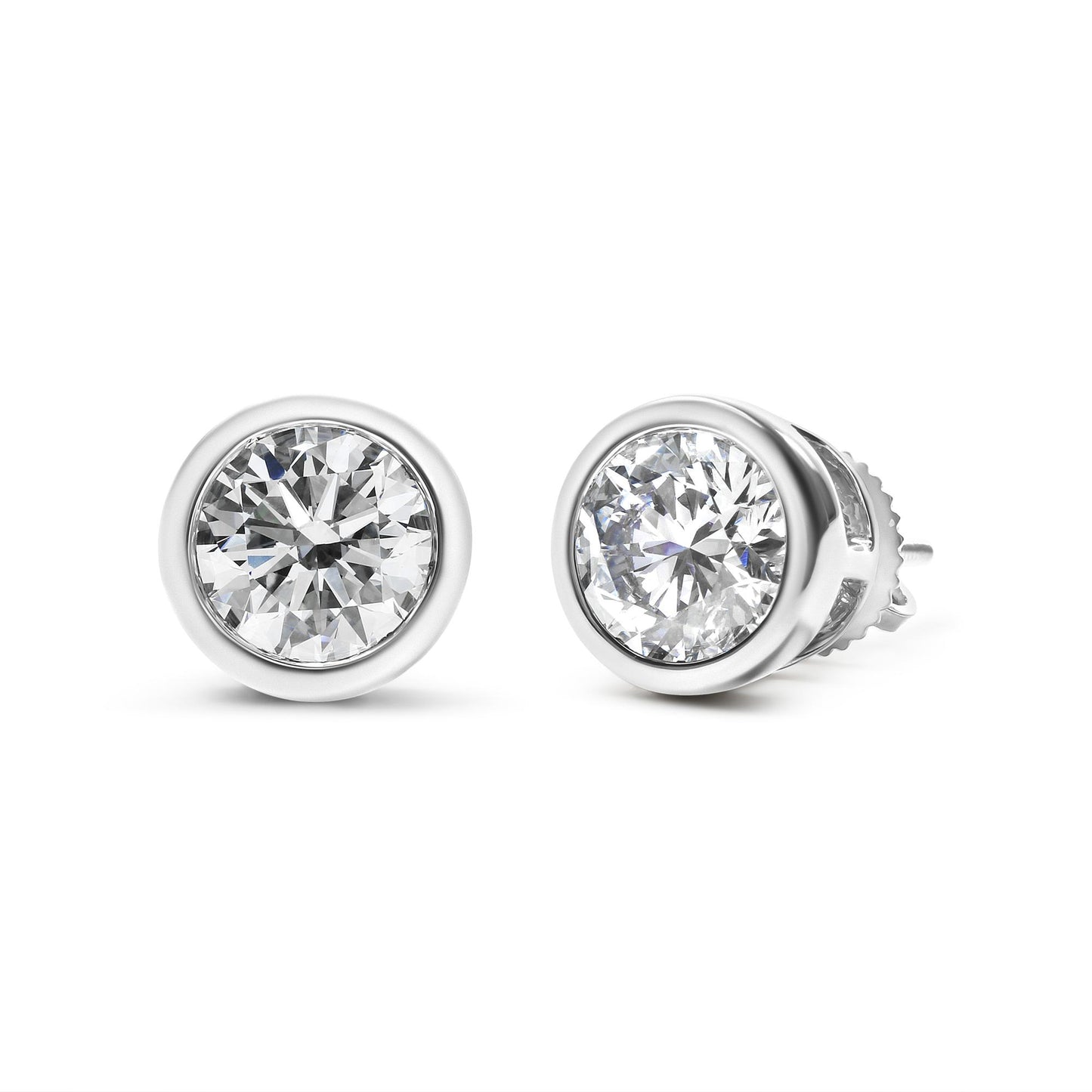 Close-up front angle of white metal round bezel-set stud earrings with white gemstones.