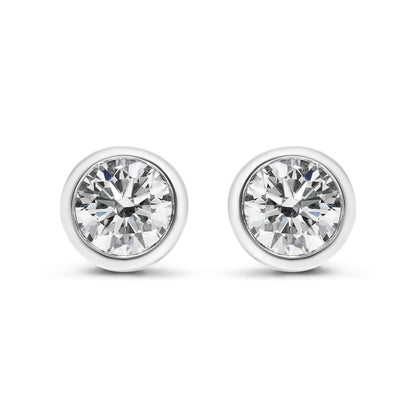 Front view of white metal round bezel-set white gemstone stud earrings.