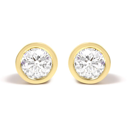 Front view of a pair of yellow metal stud earrings each featuring a round white gemstone in a bezel setting.