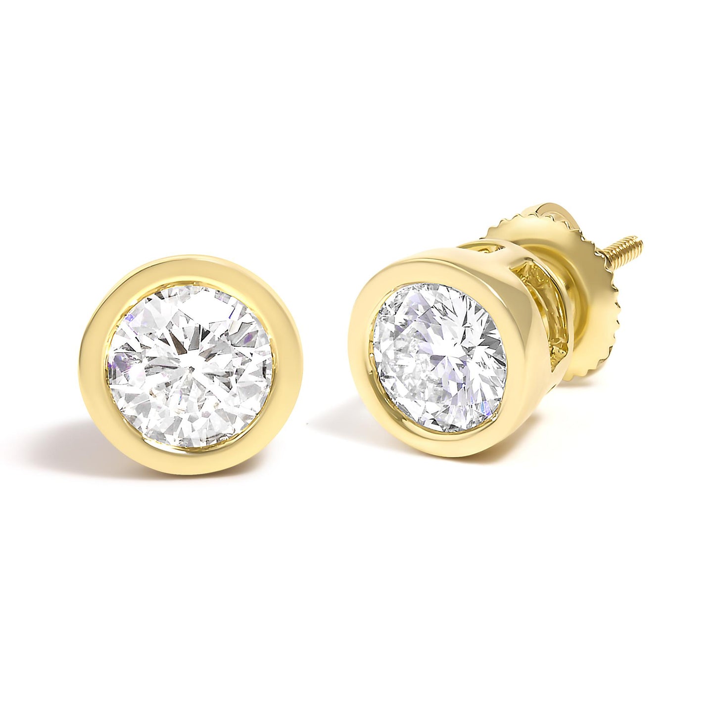 Close-up front and angled view of yellow metal stud earrings with round white gemstones in bezel setting.