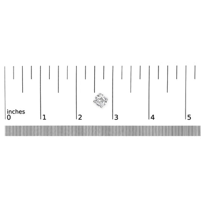 Close-up top view of a single white metal earring with a round white gemstone in a four-prong setting, placed on a ruler for size reference.