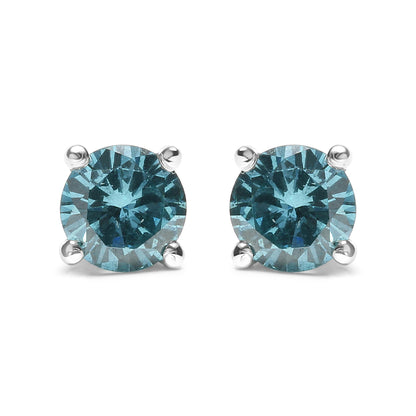 Front view of white metal stud earrings featuring round aqua blue gemstones in prong settings.