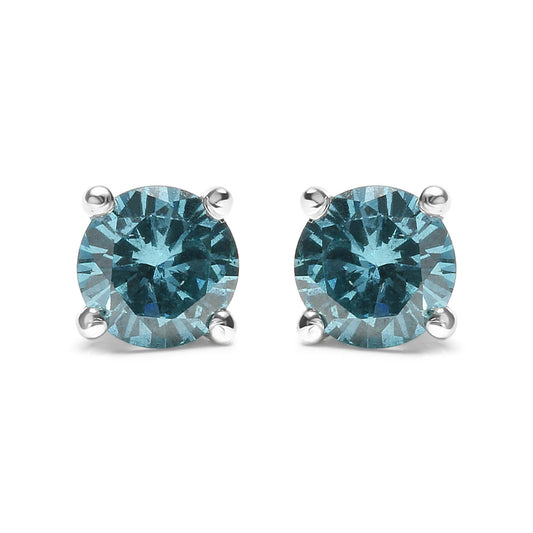 Front view of white metal stud earrings featuring round aqua blue gemstones in prong settings.