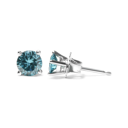 Close-up, front and side view of white metal stud earrings with round aqua blue gemstones in prong settings.