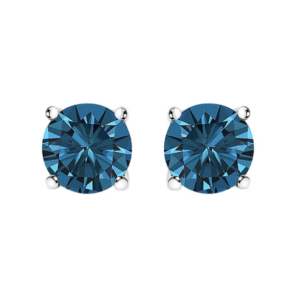 Front view of white metal stud earrings with round blue gemstones in four-prong settings.