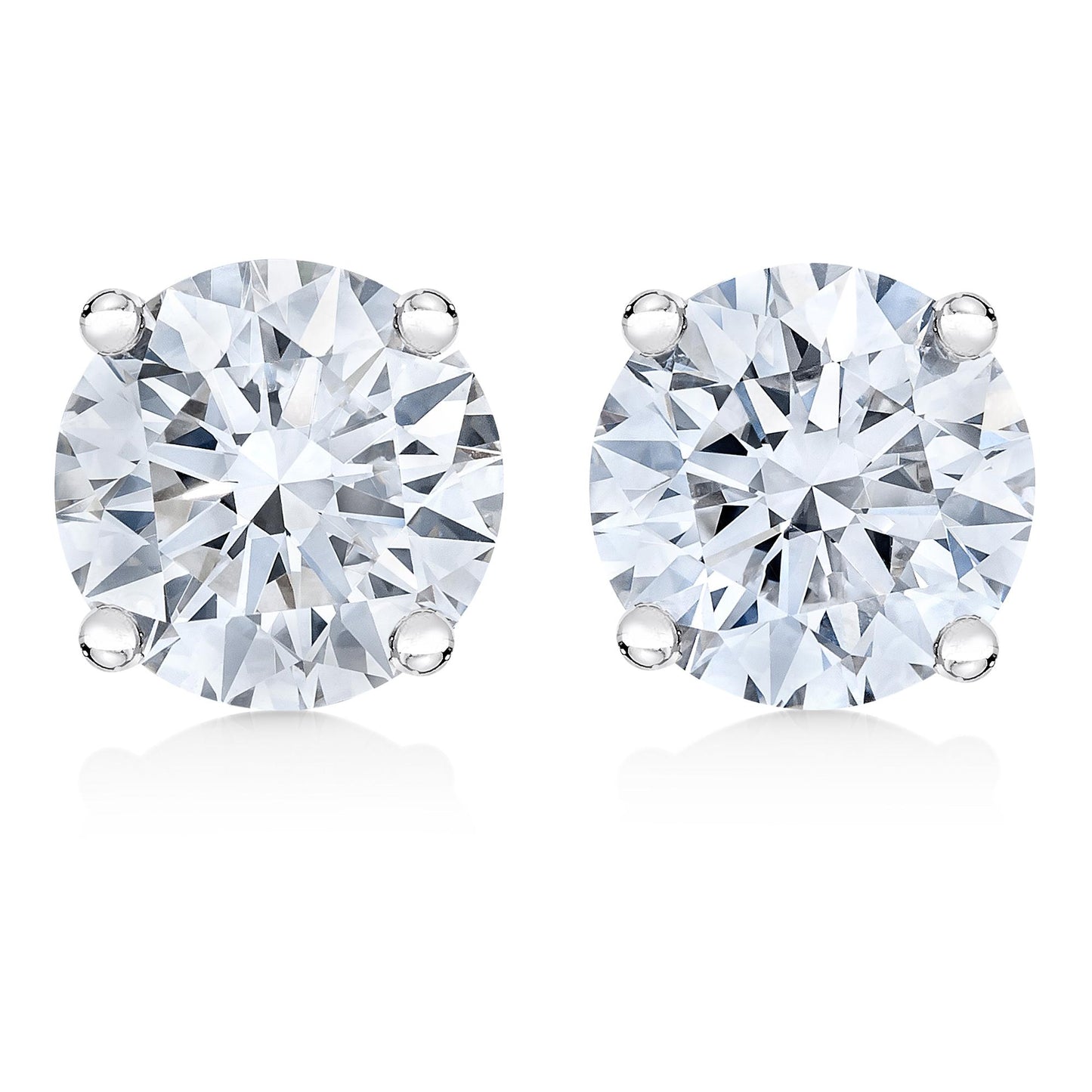 Close-up front view of a pair of white metal stud earrings, each featuring a round white gemstone in a four-prong setting.