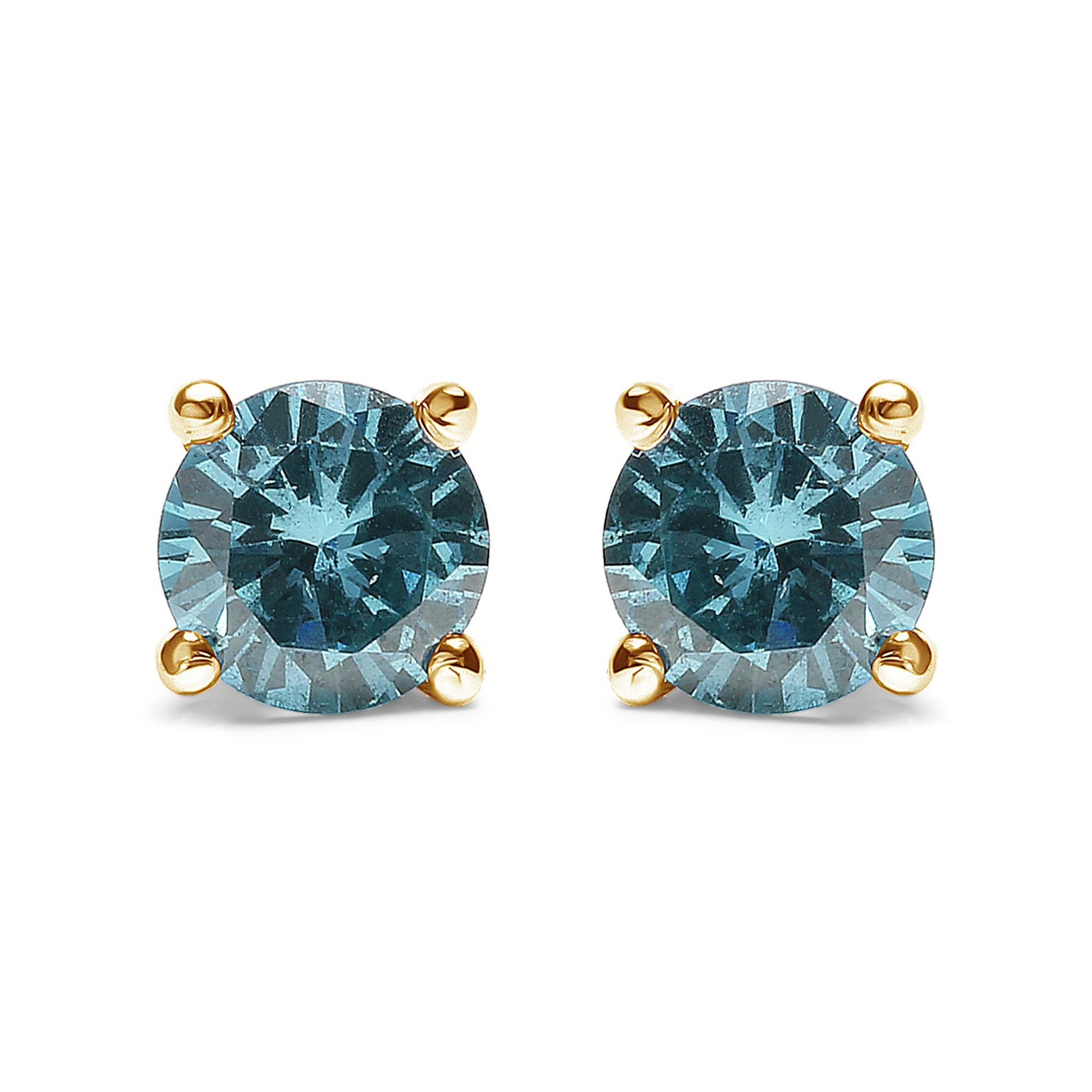 Front view of yellow metal stud earrings with round aqua blue gemstones in prong settings.