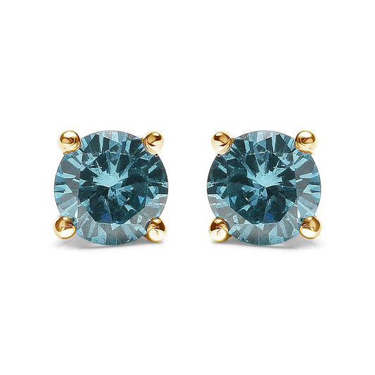 Front view of yellow metal stud earrings with round aqua blue gemstones in prong settings.