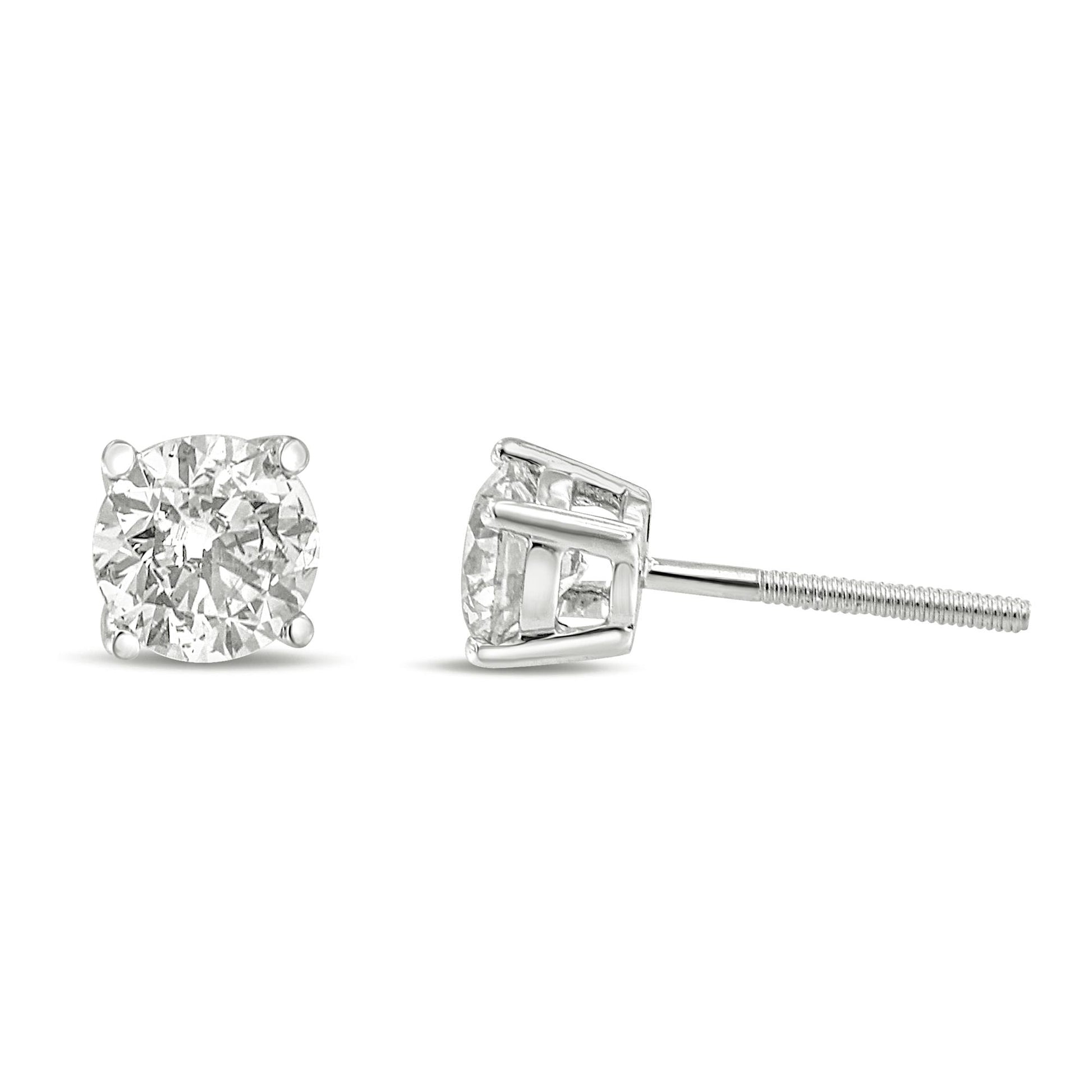 Front and side view of white metal stud earrings with round white gemstones in a 4-prong setting against a white background.