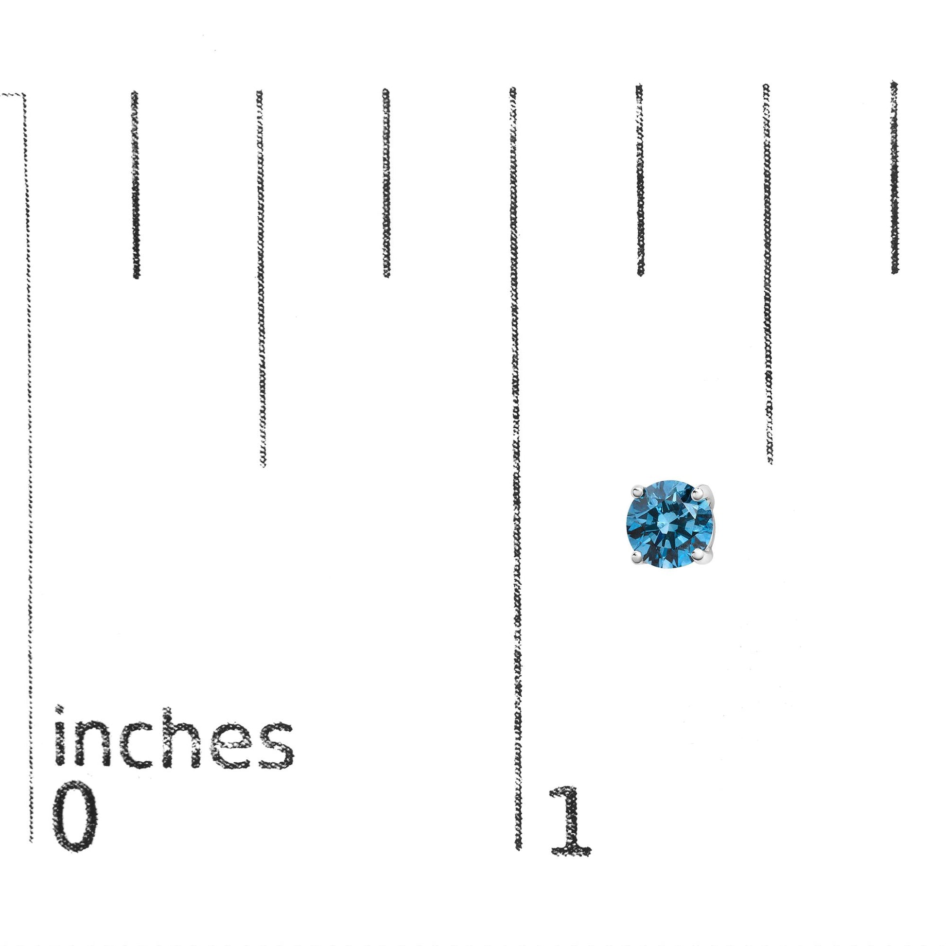 Single white metal stud earring with a round blue gemstone in 4-prong setting, shown on a ruler for size reference, top-down angle.