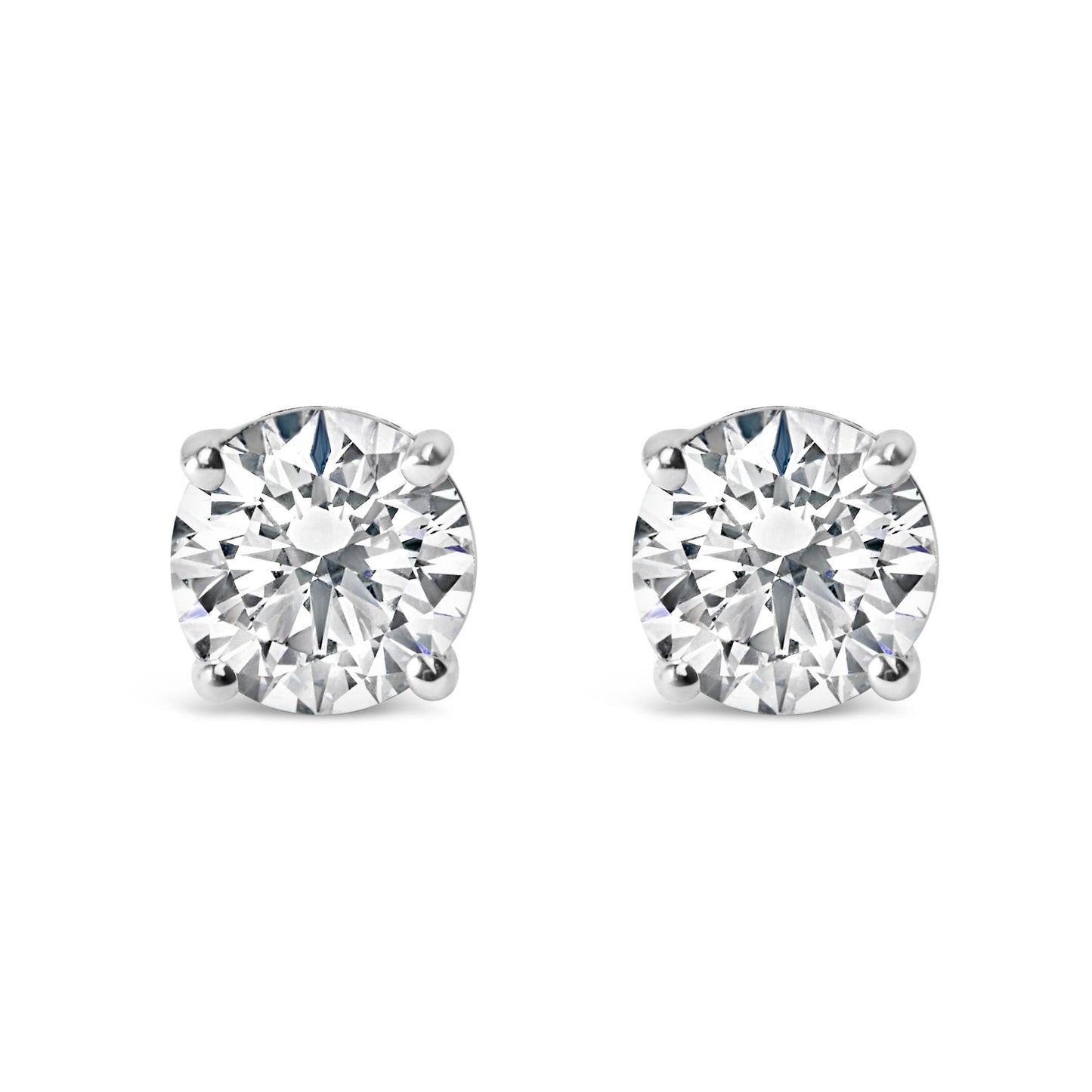 Front view of a pair of white metal stud earrings with round white gemstones in 4-prong settings.