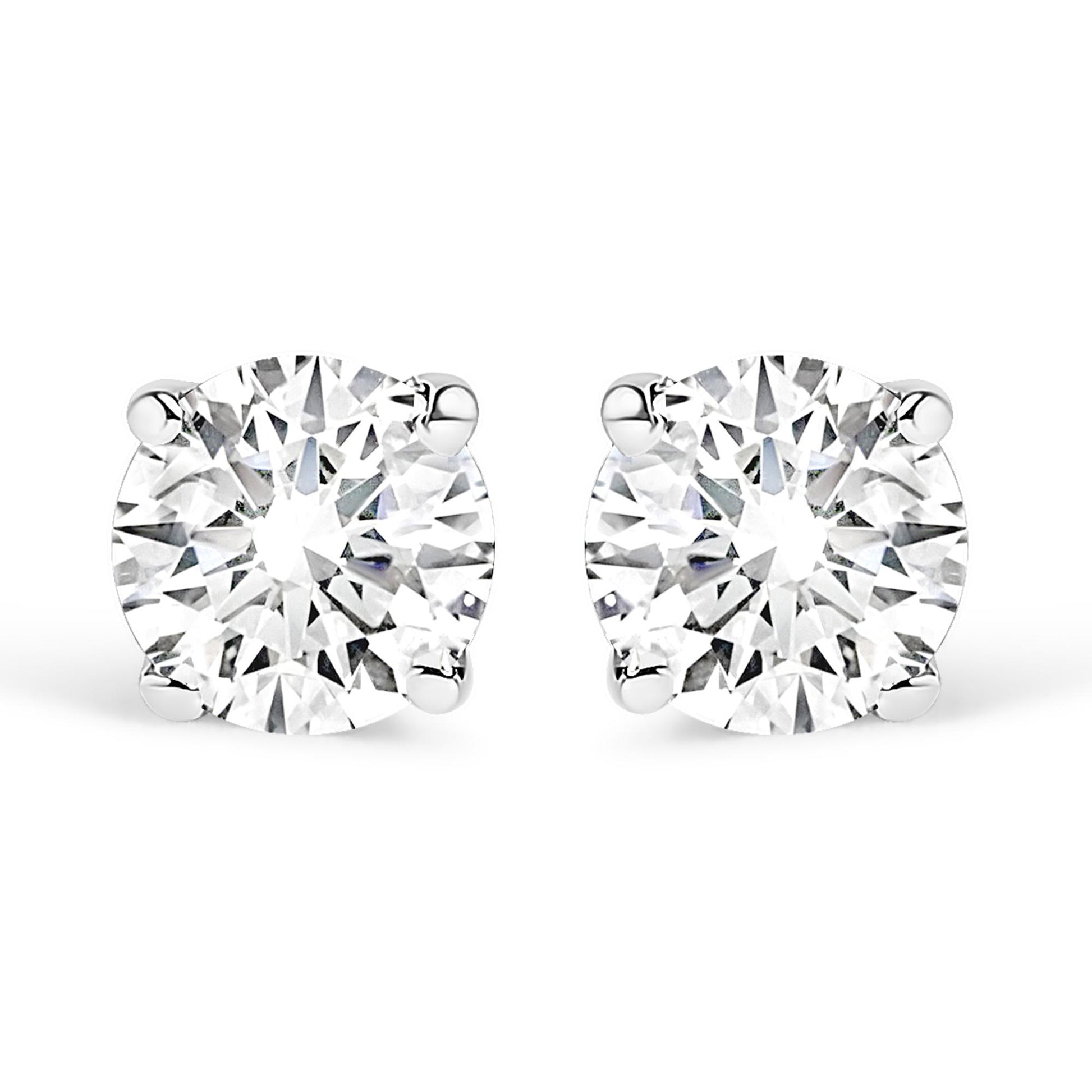 Close-up front view of a pair of white metal stud earrings, each featuring a round white gemstone in a four-prong setting, shown against a white background.