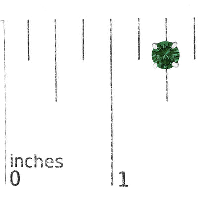 Close-up of a single white metal earring with a round green gemstone in a 4-prong setting, shown on a ruler for size reference.