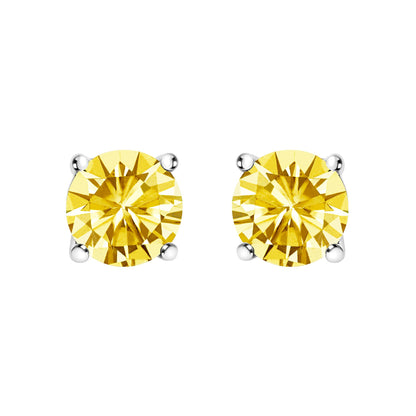 Close-up front view of a pair of white metal stud earrings, each set with a round yellow gemstone held by a four-prong setting.