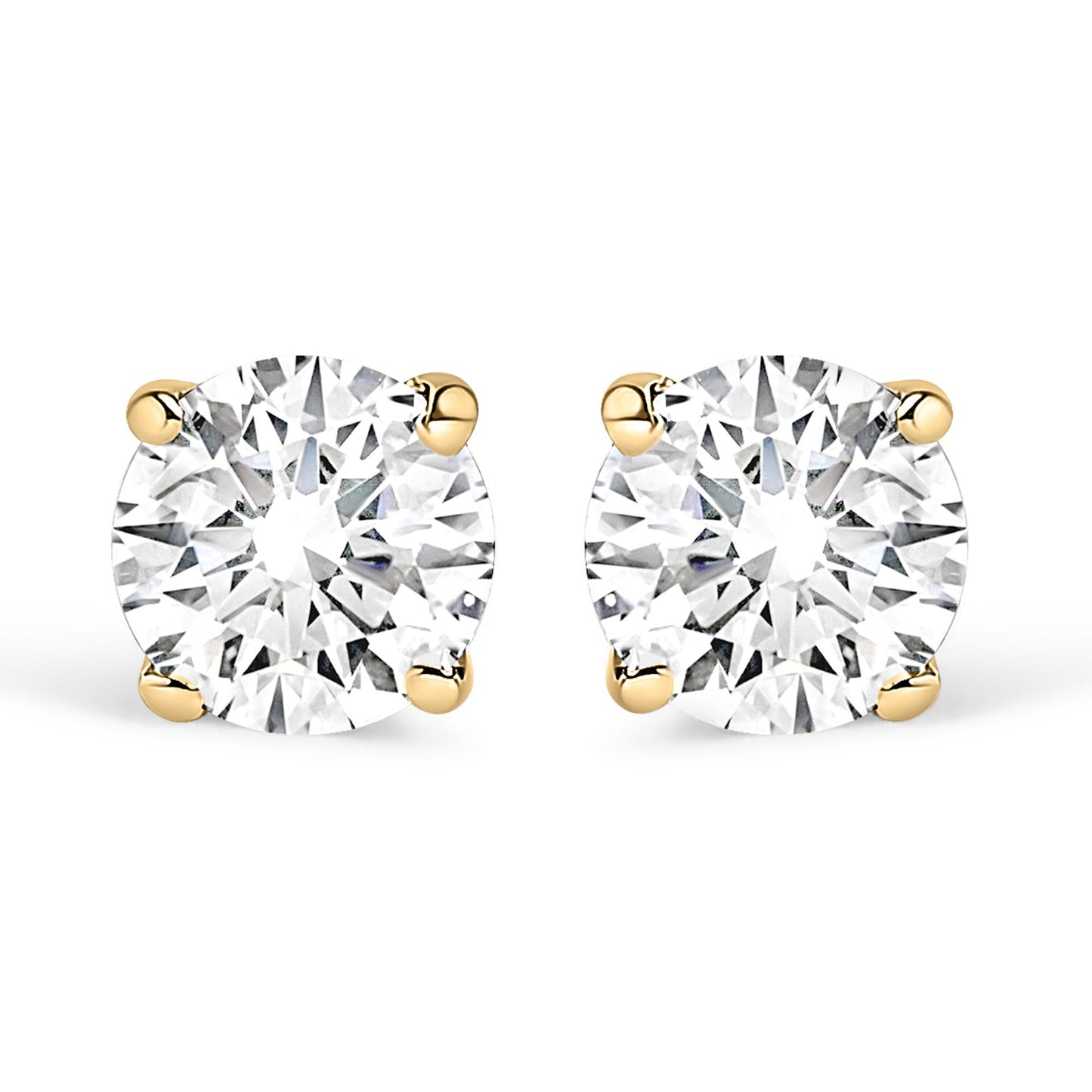 Front view of yellow metal stud earrings with round white gemstones in four-prong settings.