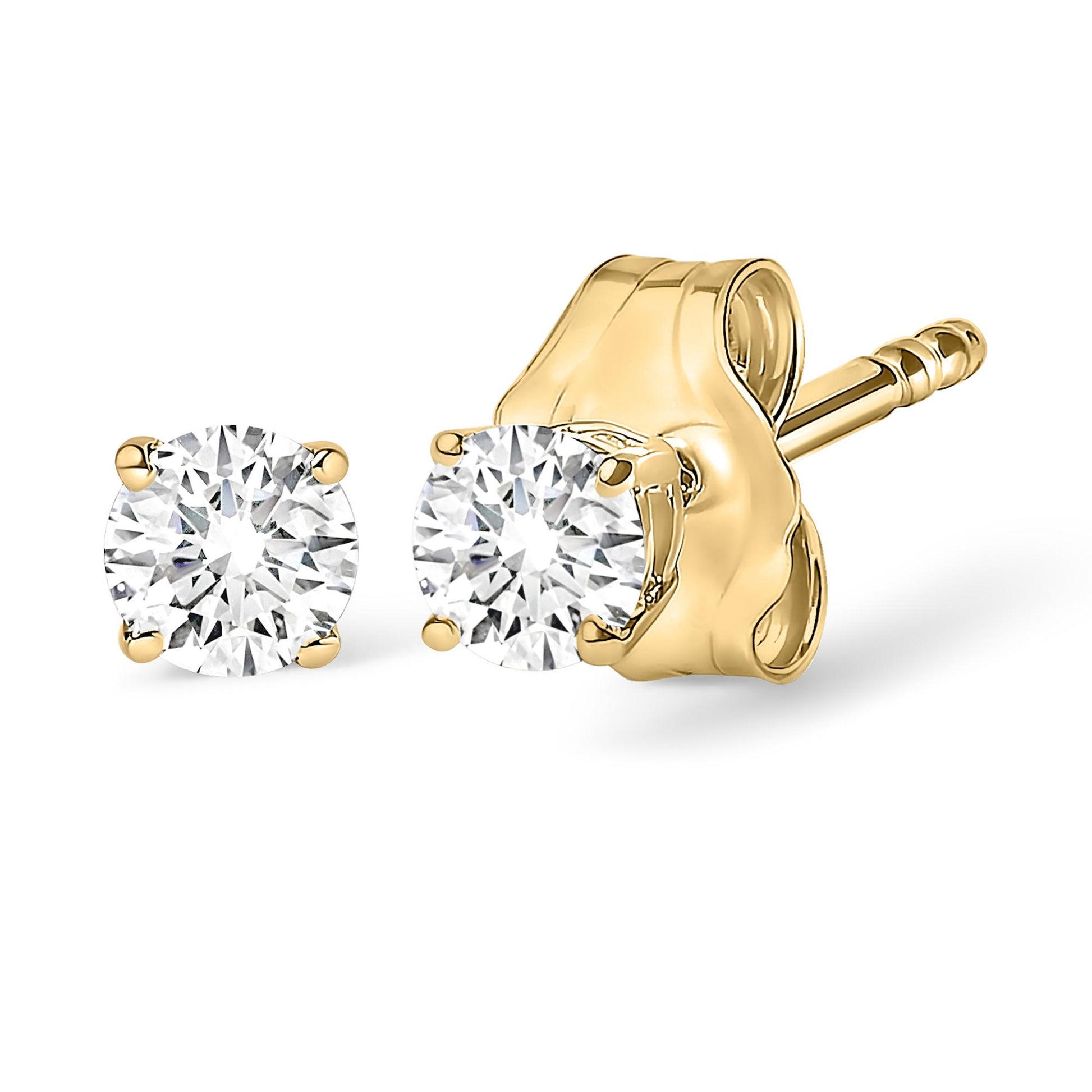 Close-up front and side angled view of yellow metal stud earrings with round white gemstones in 4-prong settings.