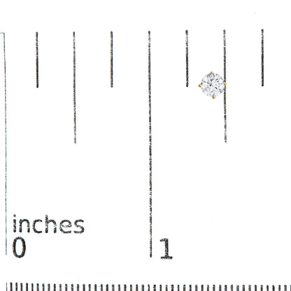 Yellow metal stud earring with a round white gemstone in a four-prong setting, shown on a ruler for size reference, front angle.