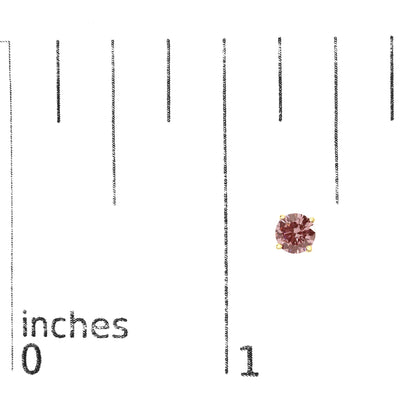 Close-up front view of a yellow metal stud earring with a round pink gemstone set in a 4-prong setting, placed on a ruler for size reference.