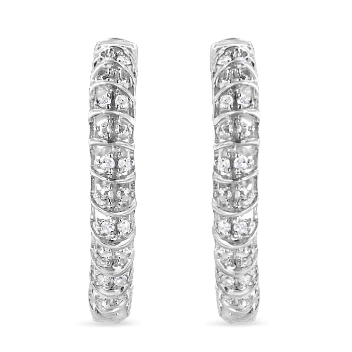 Front-facing view of a pair of white metal hoop earrings adorned with multiple round white gemstones in prong settings.