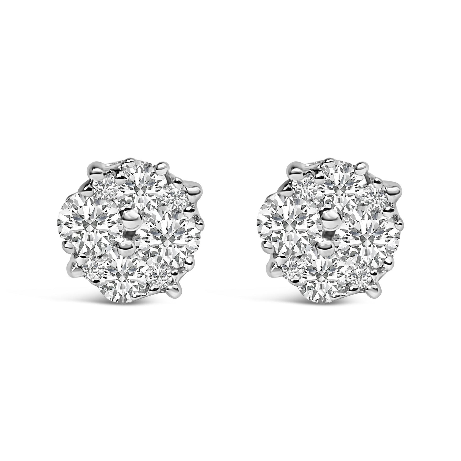 Pair of white metal stud earrings with round white gemstones in prong settings clustered in a circular arrangement, shown from a front angle on a white background.