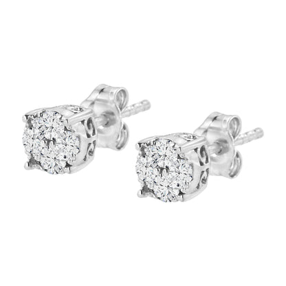 Close-up front angle of a pair of white metal stud earrings with cluster settings featuring multiple white round gemstones.