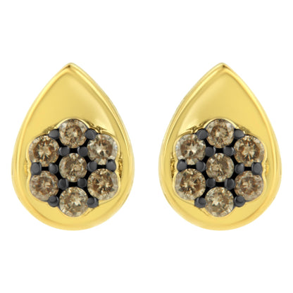 Front view of yellow metal teardrop-shaped earrings with clusters of round champagne-colored gemstones in prong settings.