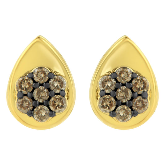 Front view of yellow metal teardrop-shaped earrings with clusters of round champagne-colored gemstones in prong settings.