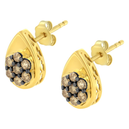Pair of yellow metal teardrop-shaped stud earrings with cluster of champagne-colored round gemstones in prong setting, shown from front angled view.